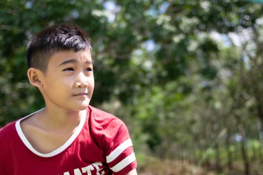 portrait asian boy looking something