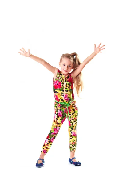 Menina loira muito pequena em macacão colorido dançando e fazendo mãos para cima gesto — Fotografia de Stock