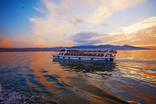 Water bus  transferring passengers in city, amazing sunset