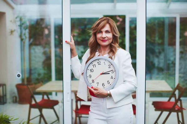 Woman with clock aging concept — Stock Photo, Image