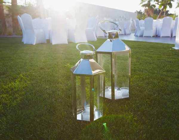 Lanterns with candle as a part of wedding decoration in garden on open air — Stock Photo, Image