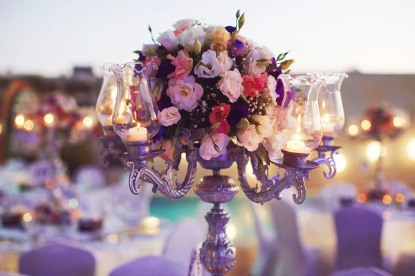 Romantic decorated with flowers celebration dinner with candles — Stock Photo, Image