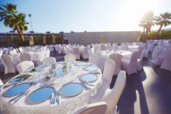 Luxury wedding decorated round tables