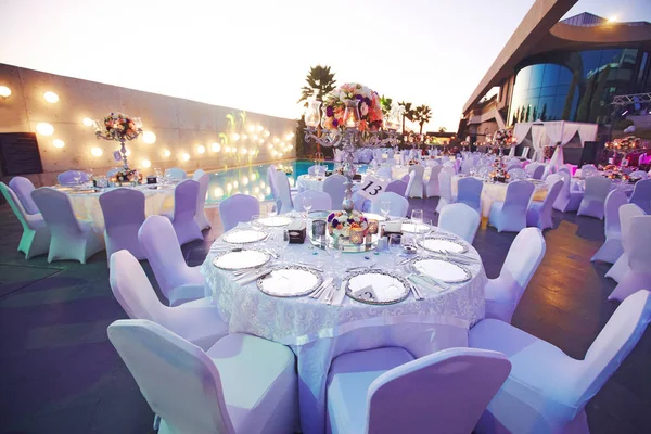 Luxury wedding decorated round tables