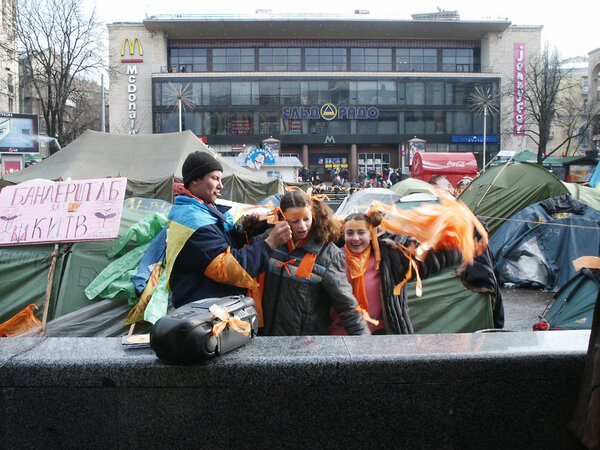 Very rare photos of the very first Orange Revolution in Ukraine in december 2004, tent camp in middle of Kiev on Maidan square, people with orange ribbon, tents, fires in middle of city