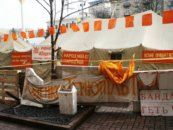 Very rare photos of the very first Orange Revolution in Ukraine in december 2004, tent camp in middle of Kiev on Maidan square, people with orange ribbon, tents, fires in middle of city