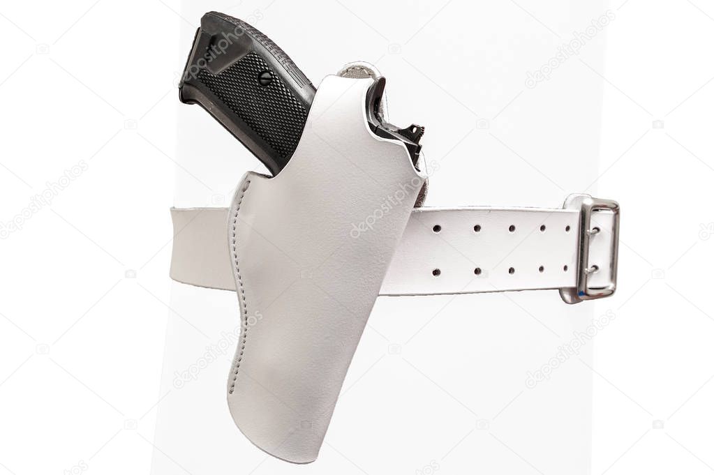 White leather two prong belt with a gun in a molded holster, clo