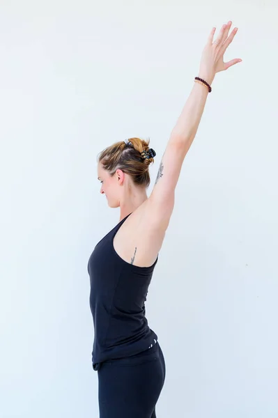 Yoga students showing different yoga poses — Stock Photo, Image