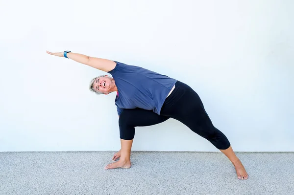 Yoga students showing different yoga poses — Stock Photo, Image