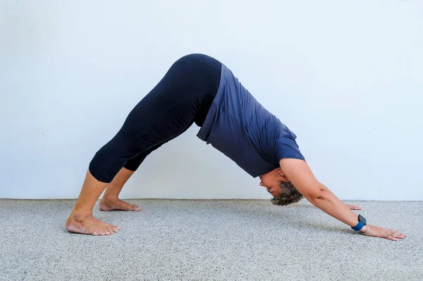 Yoga students showing different yoga poses — Stock Photo, Image