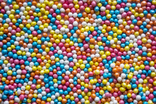 Multicolored pastel sprinkles background. Colorful little candies. Easter. Background, texture for easter, copy space — Stock Photo, Image