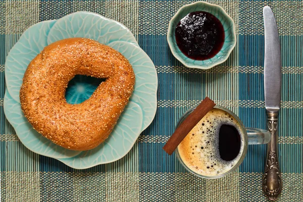 Coffee break with bagel and jam