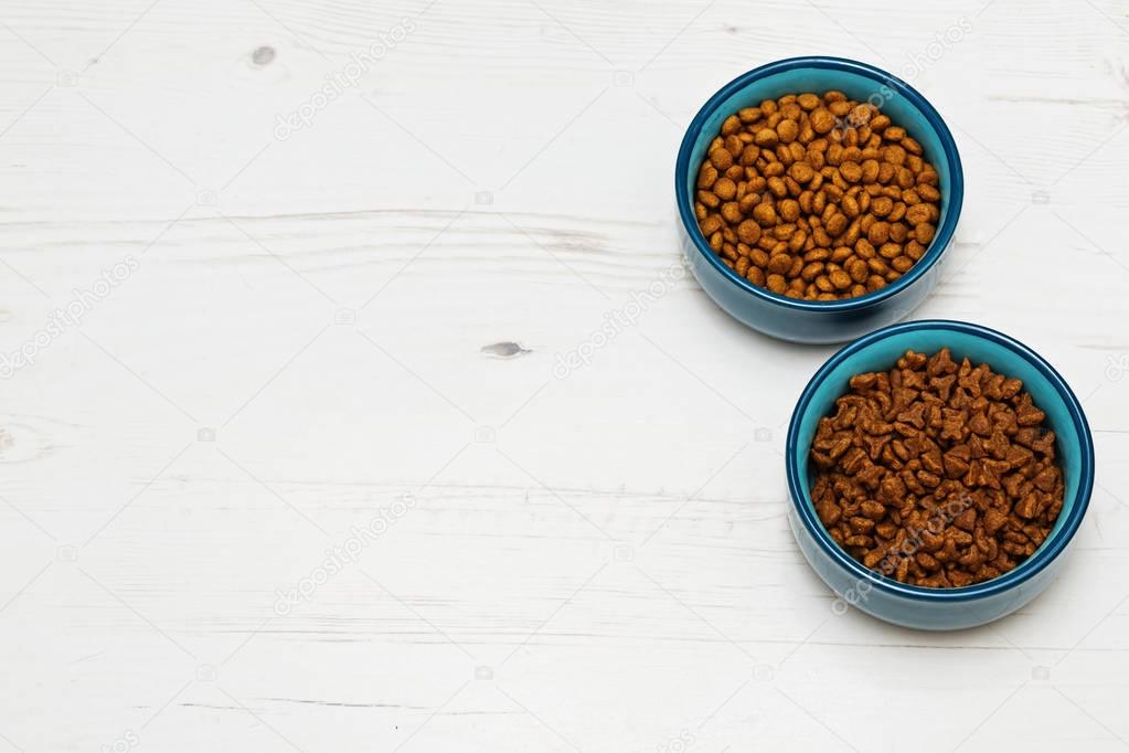 Bowls with two varieties of cat's food