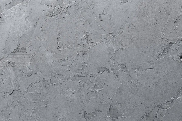 Concrete background with traces of work