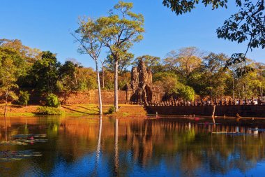 View to Angkor ancient town gate over the canal, Cambodia clipart