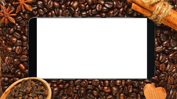 Smartphone with blank screen in frame of coffee