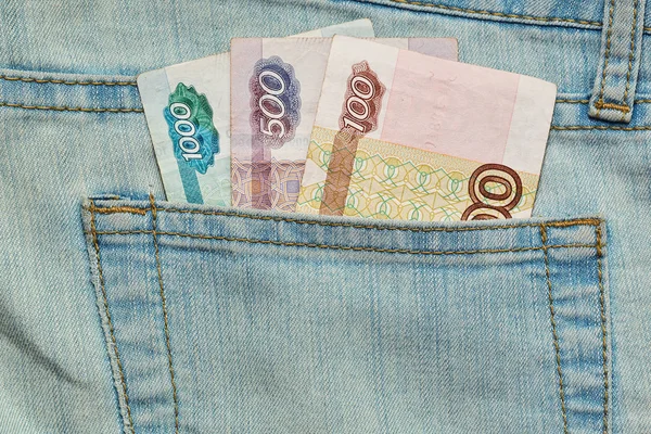 Russian currency banknotes in jeans pocket