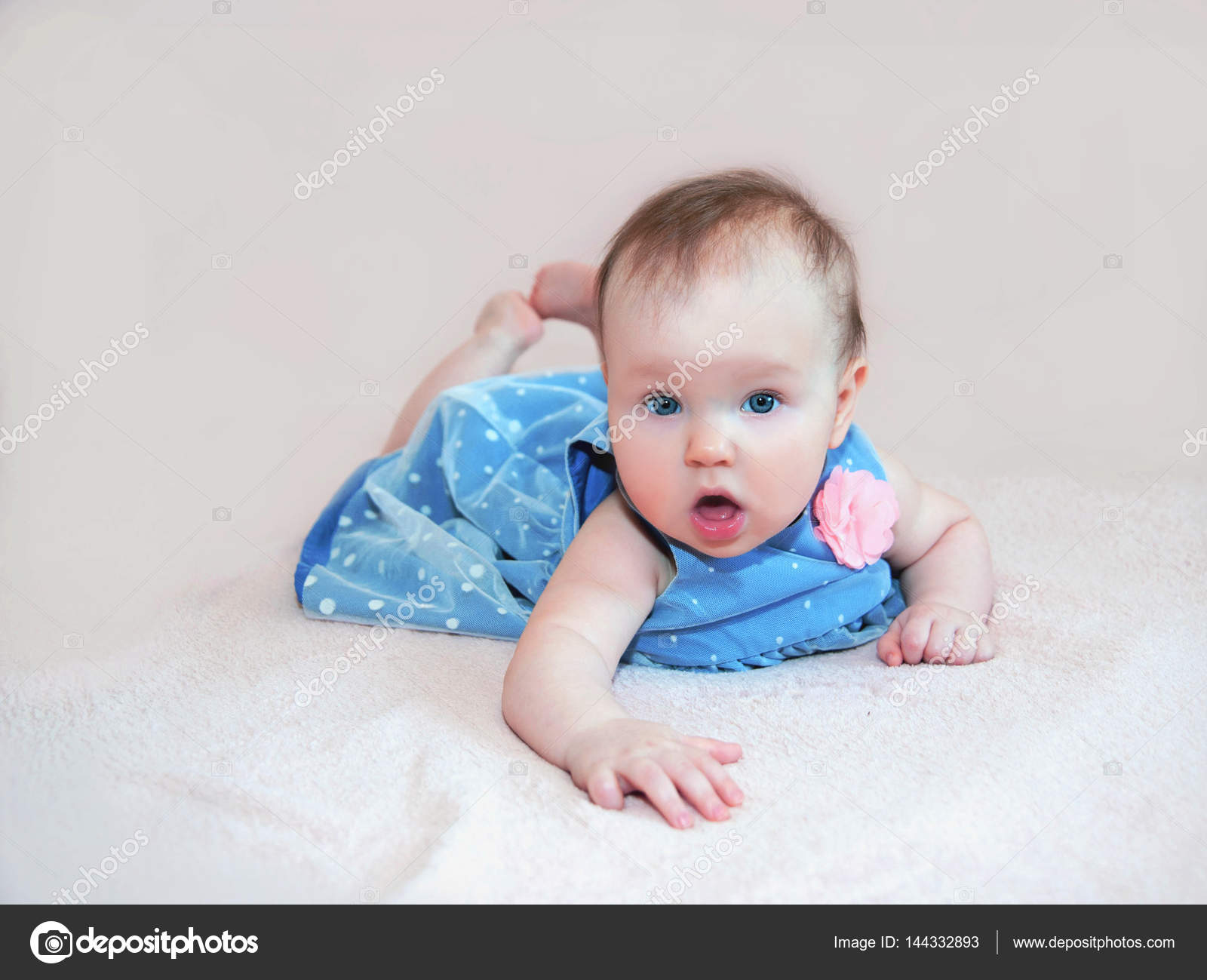 baby girl in blue dress