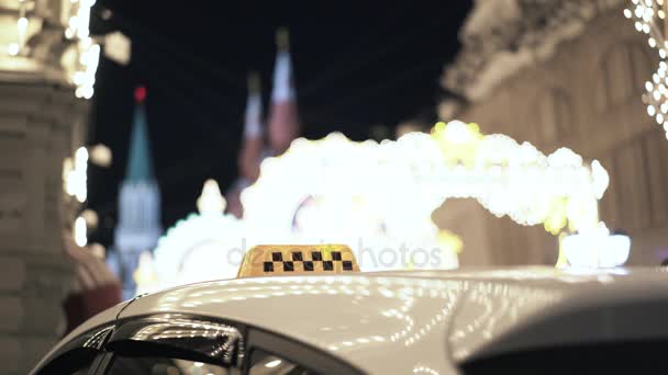 Close up of a taxi sign against Moscow panorama — Stock Video