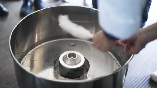 Close up of a woman making cotton candy at children s fair — Stock Video