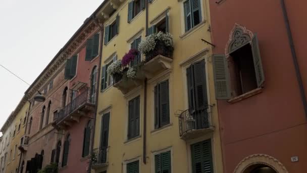 Handheld shot of coloured european walls and windows — Stockvideo