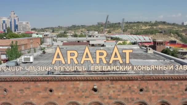 YEREVAN, ARMENIA - JULY 2019: Aerial drone zoom out of Ararat cognac factory in summer — 비디오