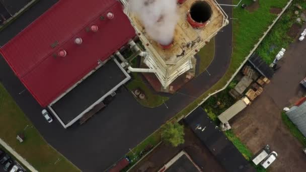 Aerial drone top view shot of an industrial tube on background of ground — Stock Video
