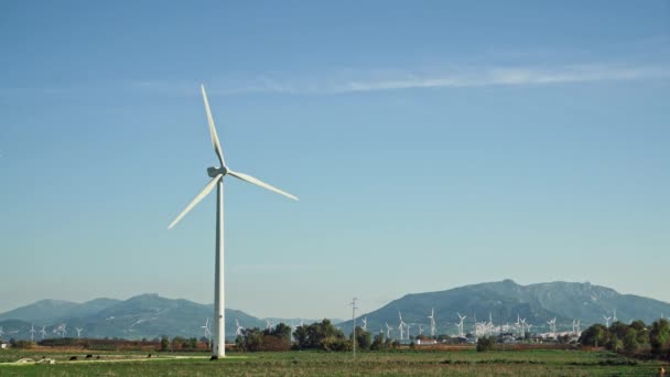 Locked down shot of windmills on background of mountains in Spain — Stock Video