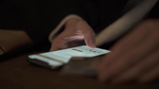 Close up of female hands with smartphone and credit card at night — Stockvideo