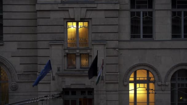 Close up shot of windows with yellow lights on — Stock video