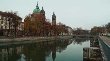 MUNICH - NOVEMBER 22: Locked down real time establishing shot of the Church of St. Luke, located on the banks of the river Isar on an autumn day, November 22, Munich, Germany.