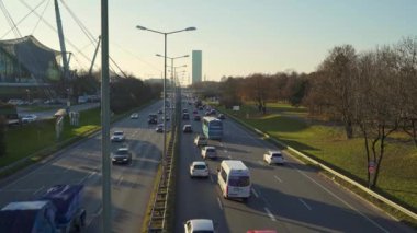 MUNICH - NOVEMBER 21: Locked down real time establishing shot of a highway near the Olympic Park in Munich. Traffic on the road, 2018 in Munich, Germany.
