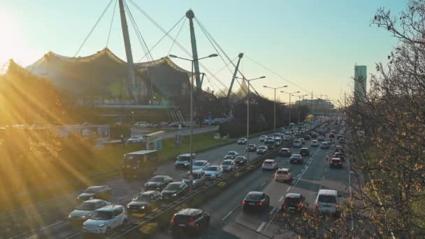 MUNICH - NOVEMBER 21: Locked down real time establishing shot of a highway near the Olympic Park in Munich. Traffic on the road, Munich, Germany. — Stock video