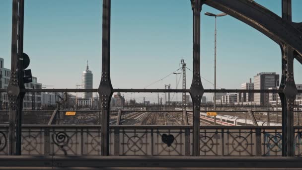 MUNICH - NOVEMBER 20: Locked down real time shot of a railway taken from a road bridge in Munich. The movement of trains on the railway and cars on the road, November 20, 2018 Munich, Germany. — 비디오