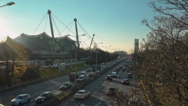 MUNICH - NOVEMBER 21: Locked down real time shot of a highway near the Olympic Park in Munich. Traffic on the road, November 21, 2018 in Munich, Germany. — Stok video