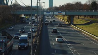 MUNICH - NOVEMBER 21: Locked down real time establishing shot of a highway near the Olympic Park in Munich, November 21, 2018 Munich, Germany.