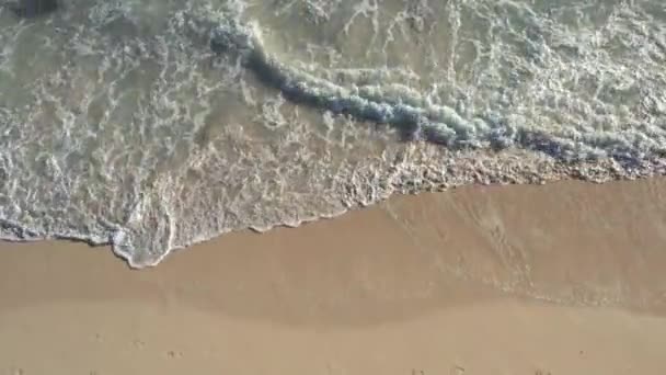 Closeup aerial drone shot of ocean surface, water and sand — 图库视频影像