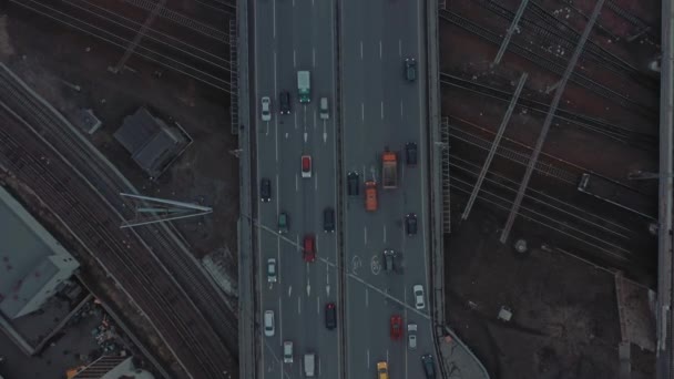 Drone flying over highway in urban area in evening time — Stock Video