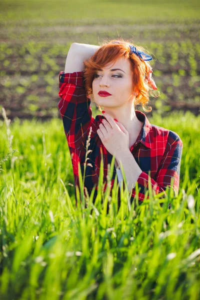 Girl on a green field background — Stock Photo, Image