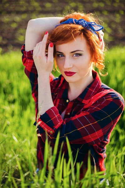 Girl on a green field background — Stock Photo, Image