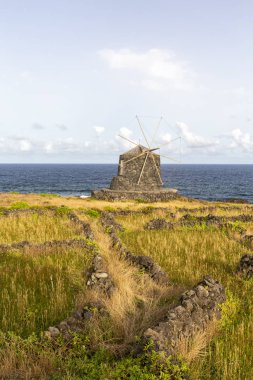 Ancient Stone Walls leading to a Wind Mill