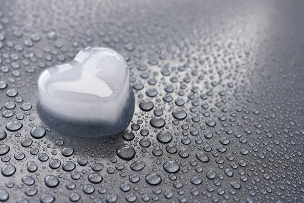 Close Image Heart Shaped Ice Cube Melting Grey Metal Background — Stock Photo, Image