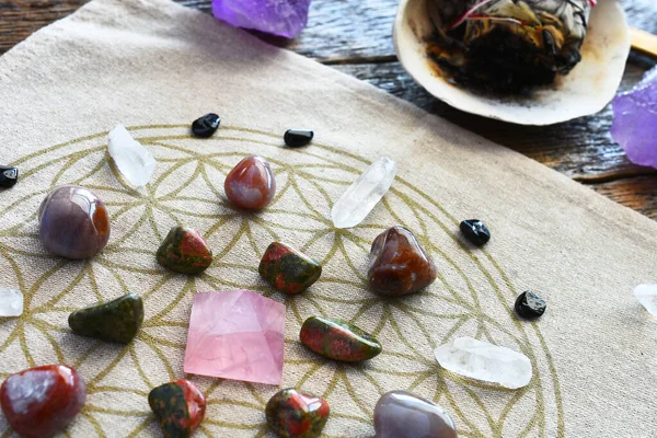 A close up image of a crystal energy healing grid using the flower of life pattern.