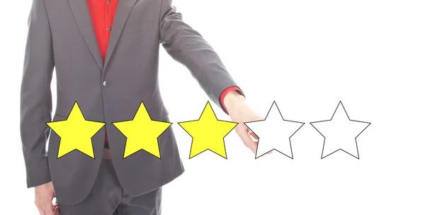 Молодой бизнесмен с 3 желтые звезды рейтинга изолированы на белом фоне — стоковое фото