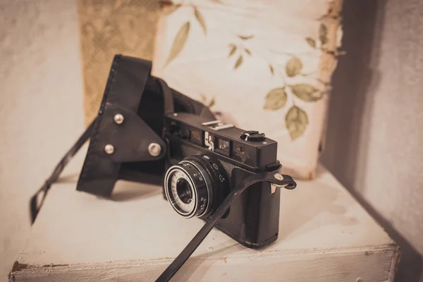 Vintage film camera with leather case on white background — Stock Photo, Image