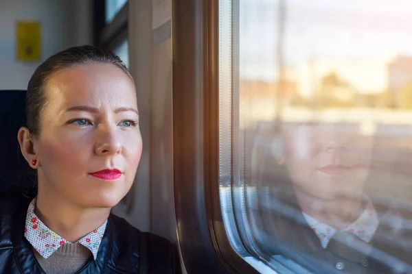 Woman traveling by train