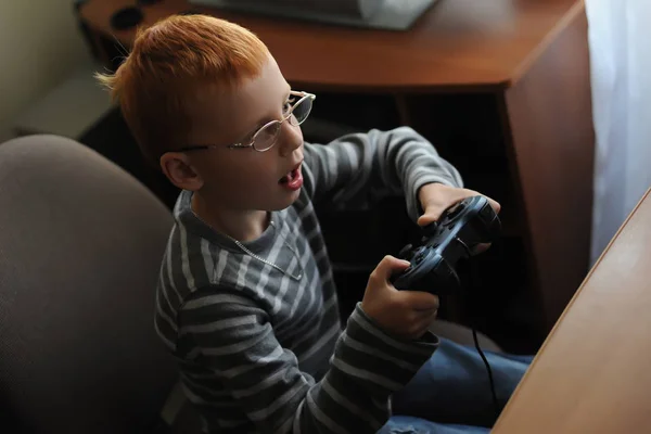 Red Haired Boy Glasses Plays Console — Stock Photo, Image