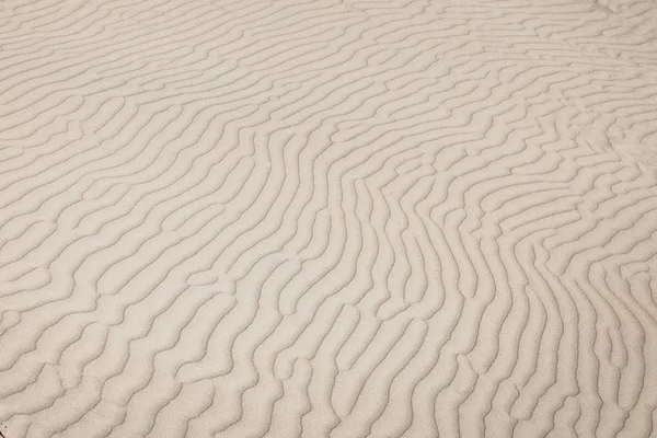 Bølgeaktig sandstruktur – stockfoto