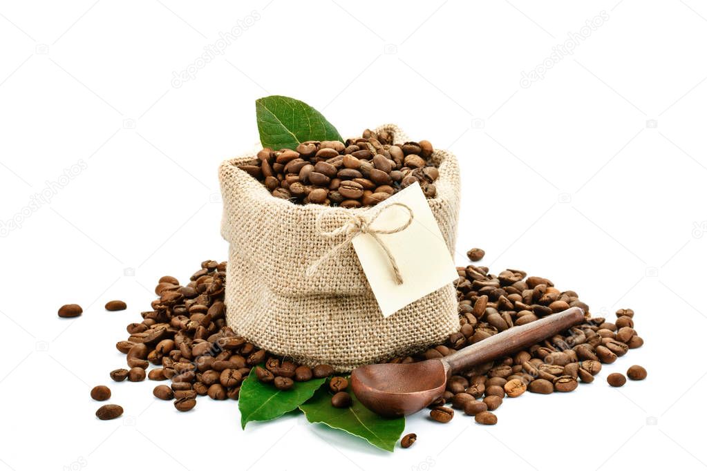 Coffee beans in a bag of sackcloth on a white background with blank tag.