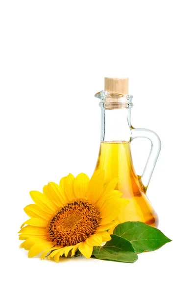 Hermosos girasoles y aceite de girasol sobre un fondo blanco . —  Fotos de Stock